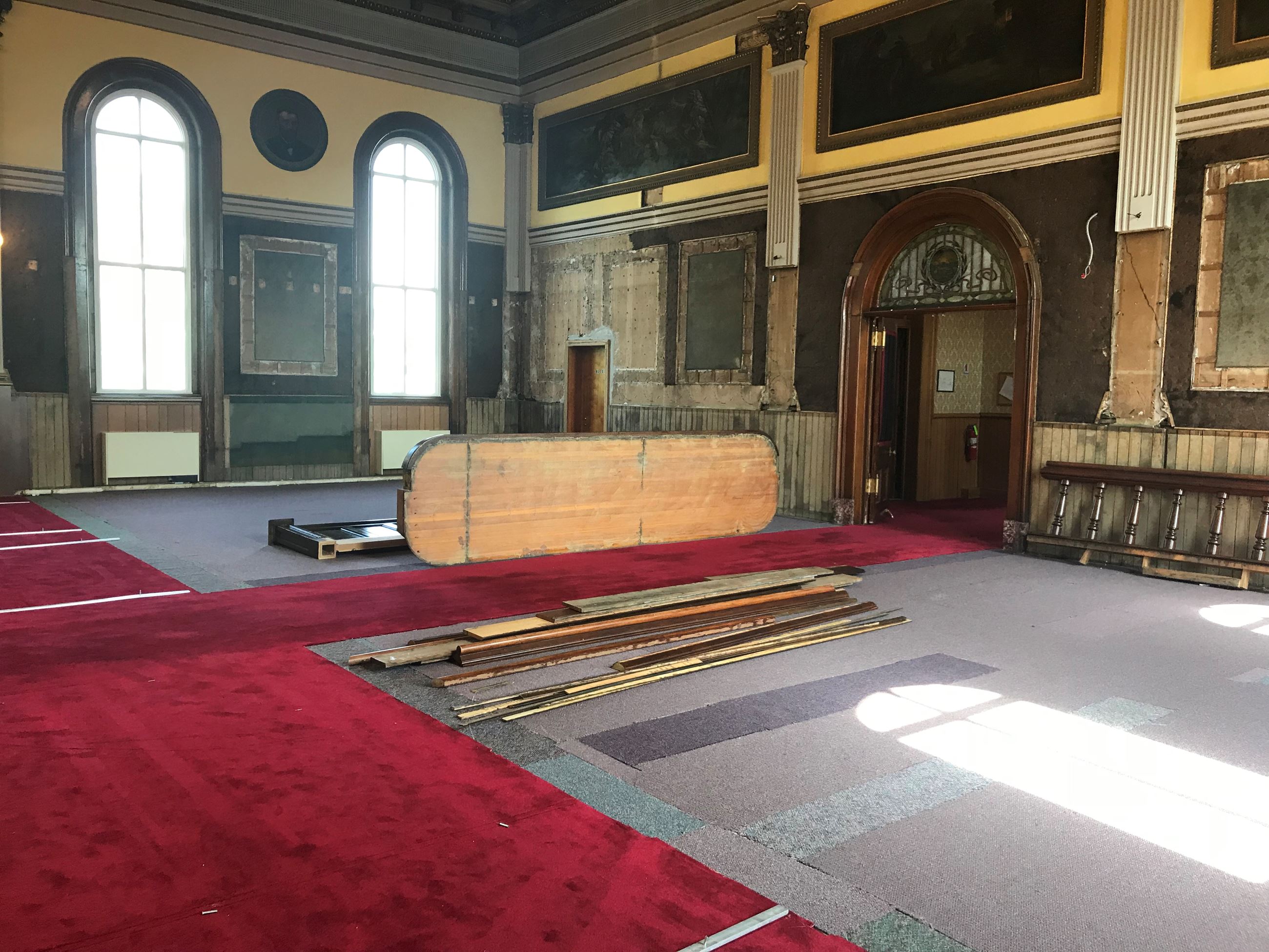 The courtroom is nearly empty as crews prepare it for historic renovation